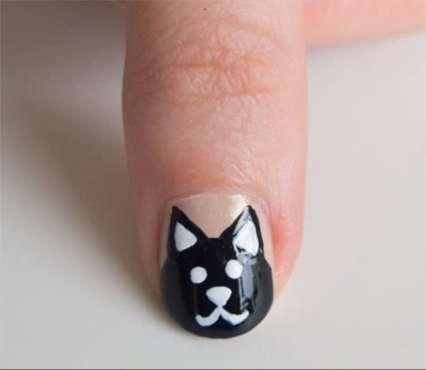 4 - طراحی و  مانیکور روی ناخن به شکل گربه سیاه